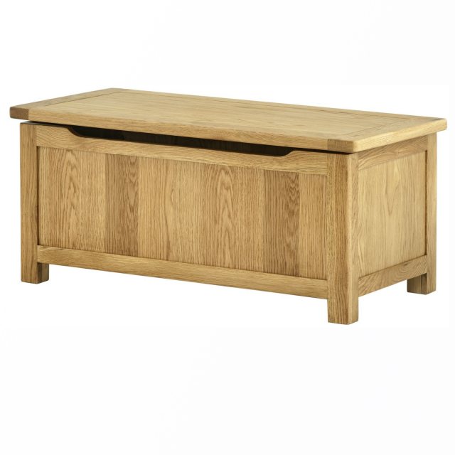 The spacious interior of the oak blanket box provides ample storage space for bulky items.
