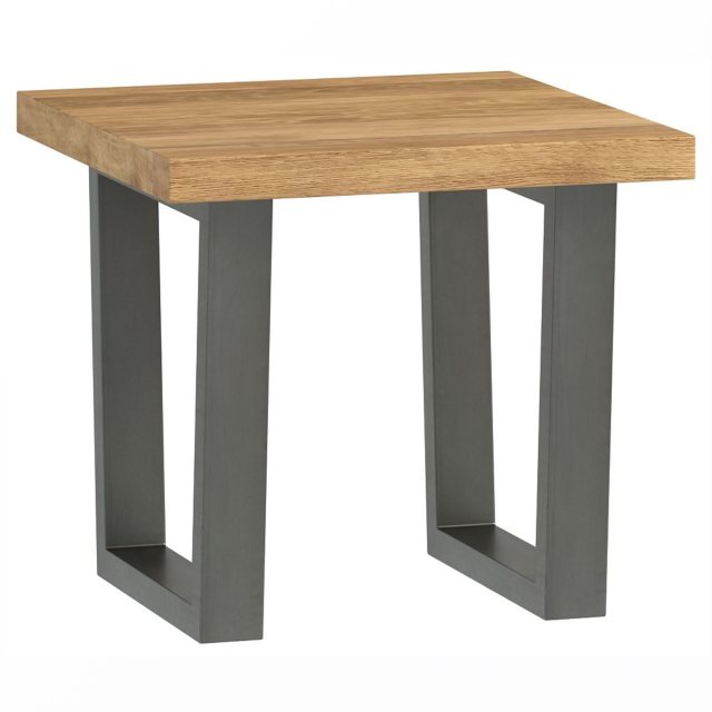 The Industrial Dining Range lamp table has a rustic oiled oak top and dark grey metal legs.