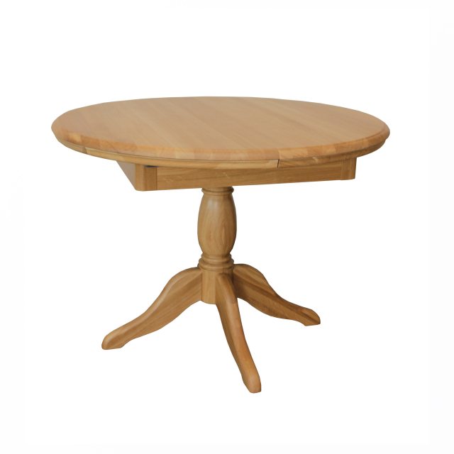 The Lamont round extending pedestal dining table is beautifully crafted from solid oak and oak venee