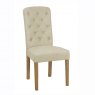 The stylish button back dining chair with painted legs is available upholstered in leather or fabric